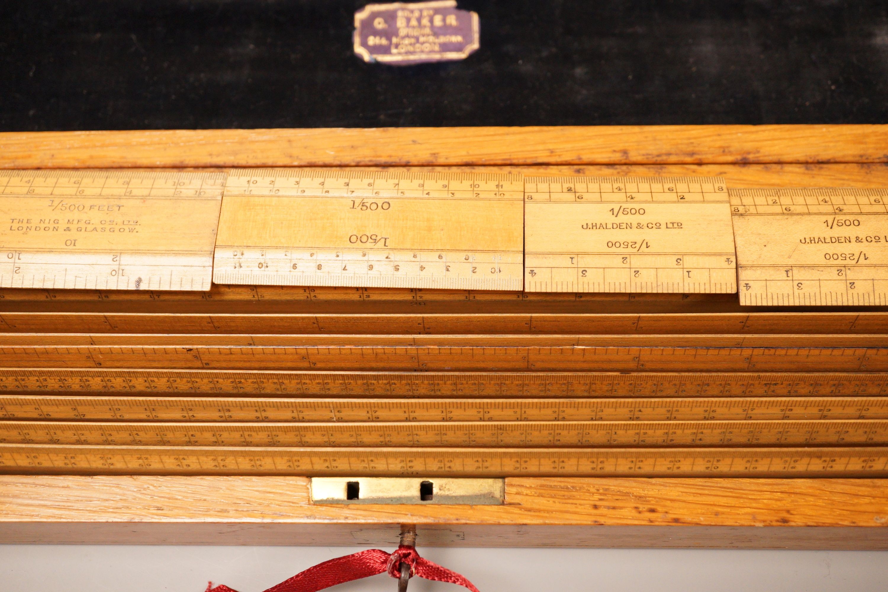An oak cased set of draughtsman's rules